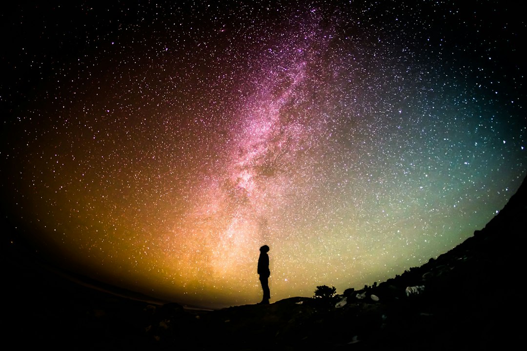 Numerology and astrology tools beneath a starry night sky