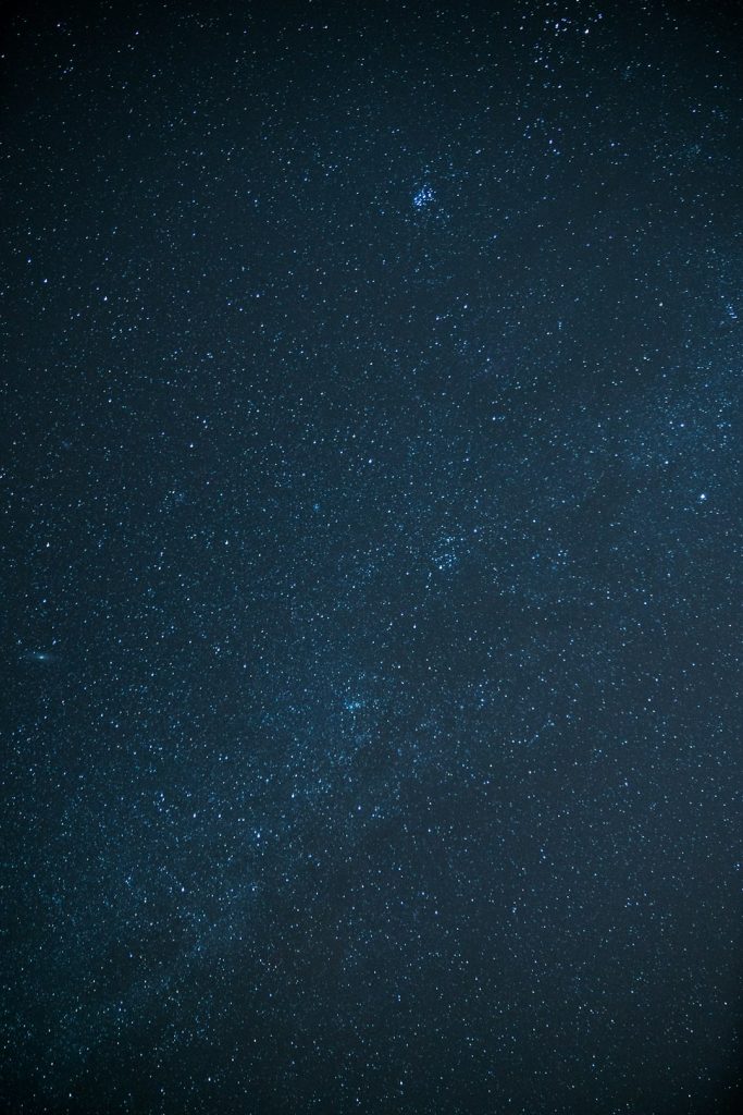Starry night sky representing Mercury-Pluto astrology transit